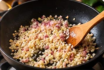 Risotto z krewetkami – etap 3: 03. Podsmażanie szalotki i czosnku